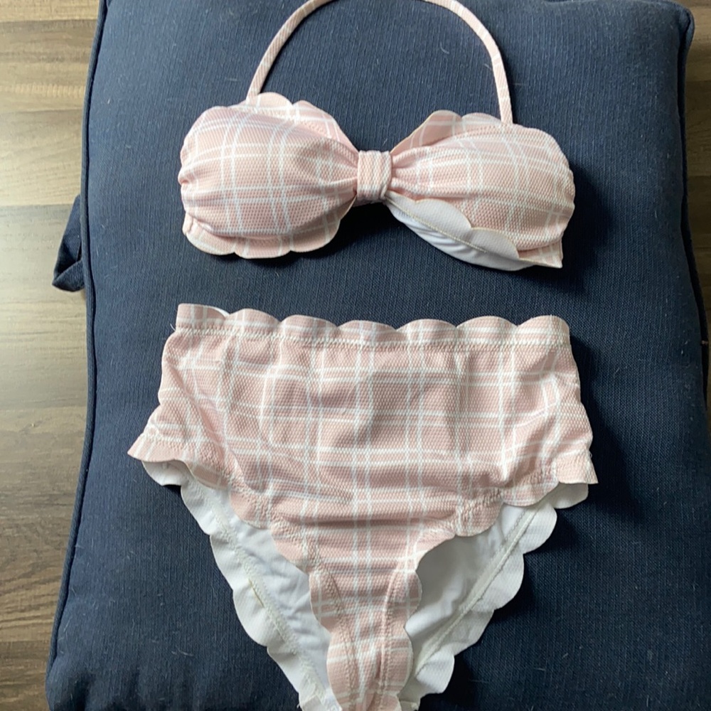 This is a pink, and white plaid swim suit set